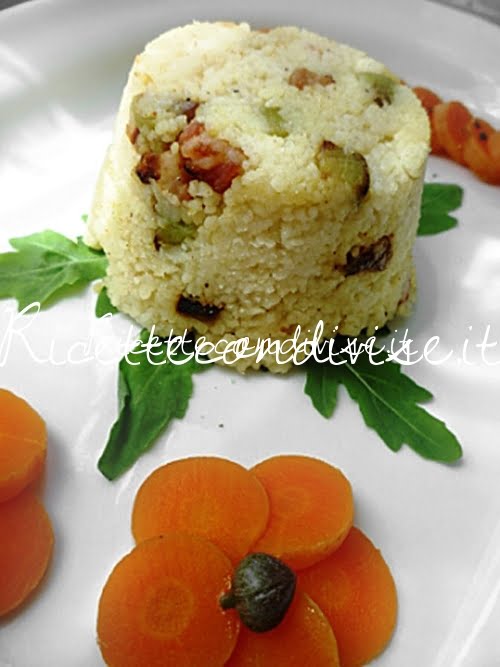 Primo piano Monoporzioni di cous cous con pancetta e melanzane a cubetti di Susi